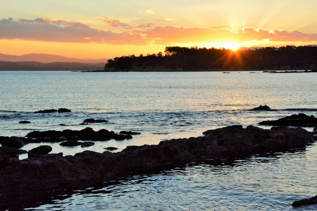 Sunset from your own private beach at Yellow Rock Beach House. Photo: Tim the Yowie Man