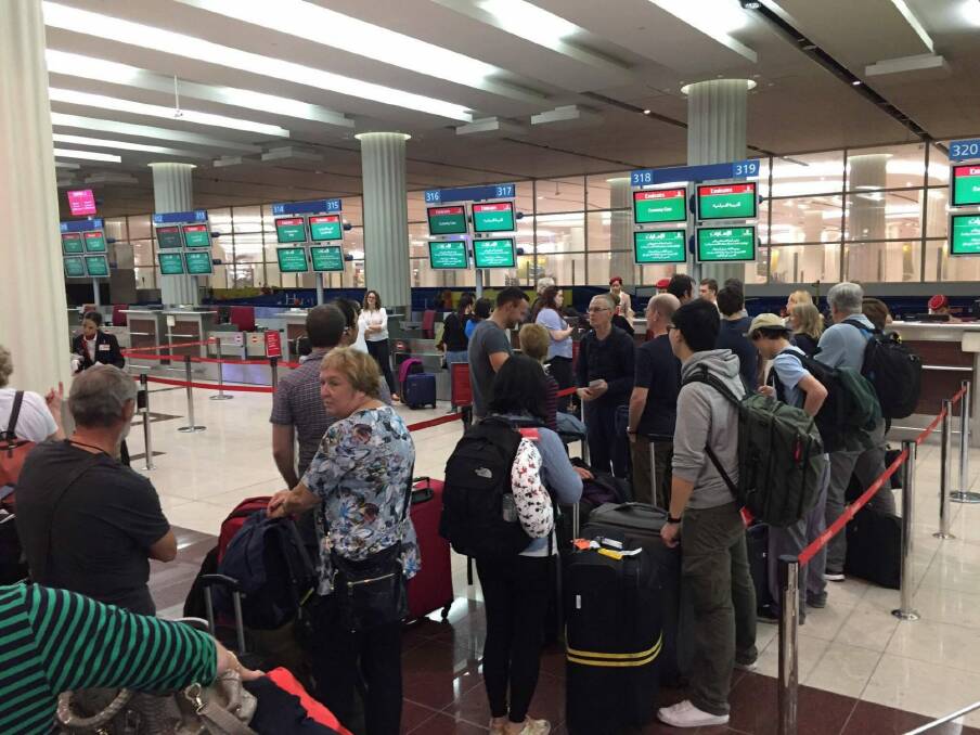 Passengers queue in hope of return to Sydney at Dubai International Airport Photo: Mia Parkes-Talbot