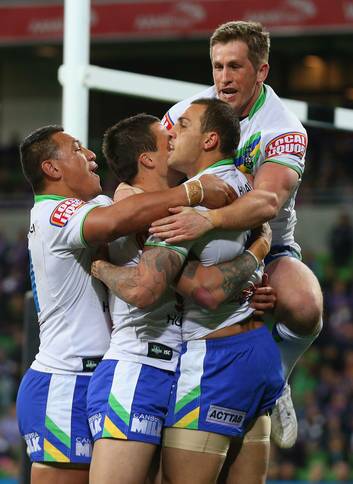 Raiders players celebrate a try against the Storm tonight. Photo: Getty Images