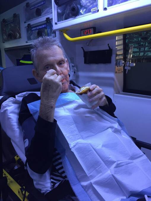 Ron McCartney enjoys a caramel sundae, given to him by ambulance workers. Photo: Facebook/Queensland Ambulance Service