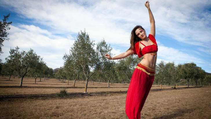 Belly dancer Chloe Morello among the olive trees. Photo: Katherine Griffiths