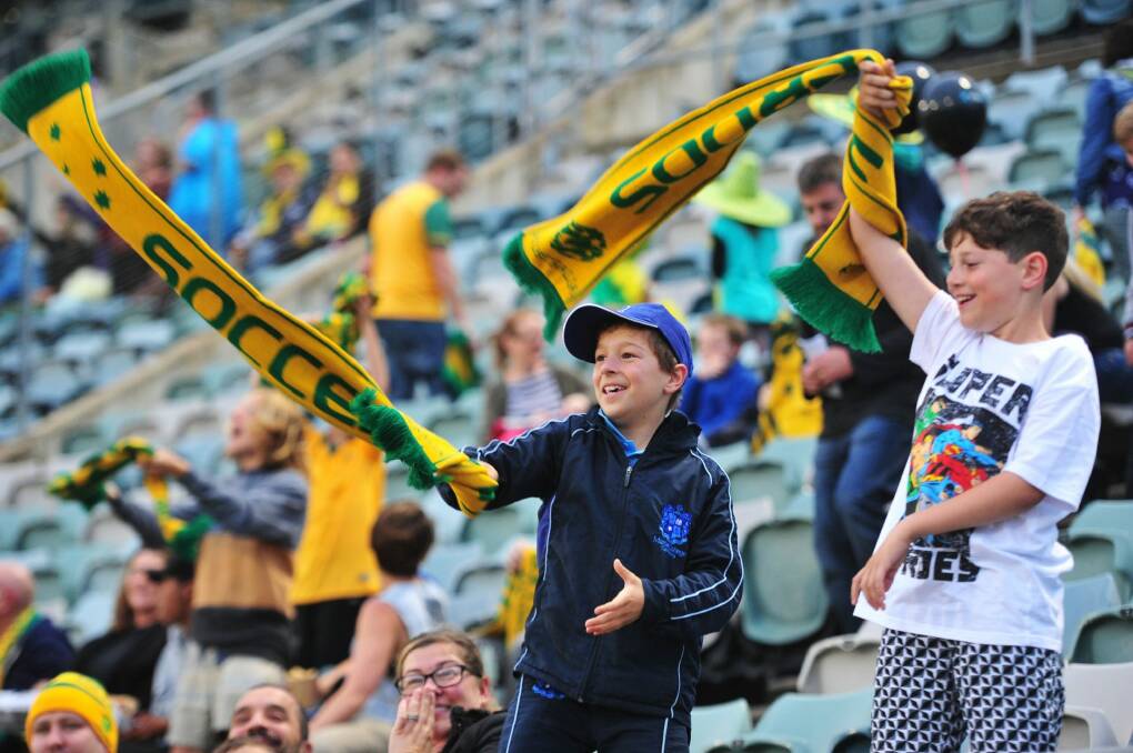  From left, Johnny Frilingos,10 of Chifley and Luca Brancella of Kambah at GIO Stadium in Canberra to see the Socceroos take on Kyrgyzstan in the World Cup qualifier.   Photo: Melissa Adams
