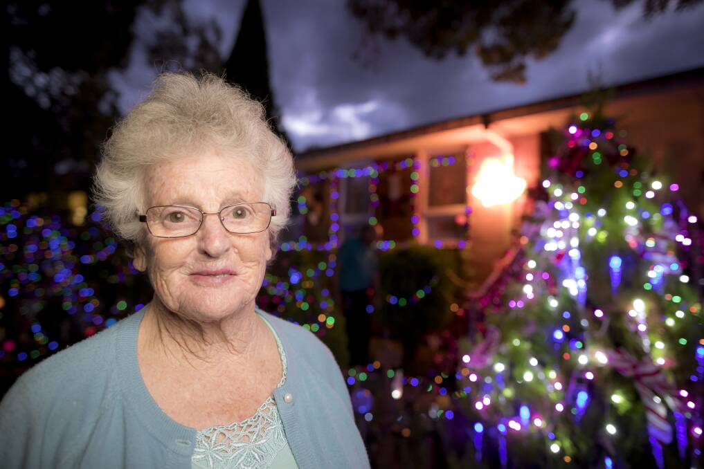 Seventy-seven-year-old Bev Lucas has put up Christmas lights around her Chifley home as a promise to her 73-year-old dying sister Valma.  Photo: Sitthixay Ditthavong