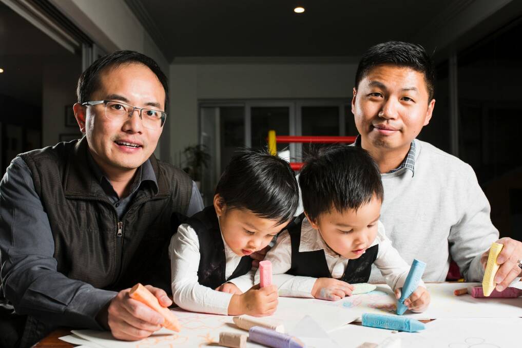 Chan Feng Lin-Wu and Travis Lin-Wu with their two and a half year old twins Jonathan (left) and Jeremy (right). Photo: Jamila Toderas