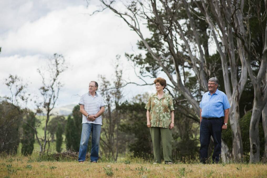 David Carroll, Roslyn Chan, and John Dash near the CSIRO Ginninderra field station which the CSIRO is hoping to have rezoned. Photo: Rohan Thomson