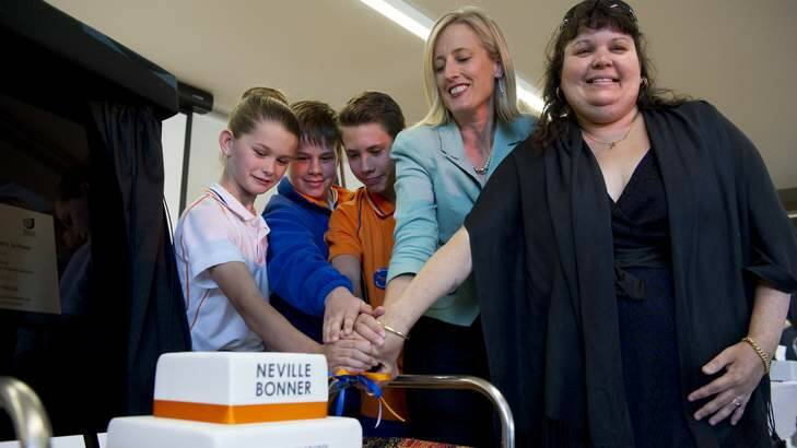Cutting the cake to mark the opening of the Neville Bonner Primary School, (l-r) year 6 pupils, Kayla Ellis, Connor Jarrett, and Reece Staker with ACT Chief Minister Katy Gallagher and great niece of Neville Bonner, Kerry Lindgren-Smith. The Canberra Times 15 November 2013 Photo Jay Cronan Photo: Jay Cronan