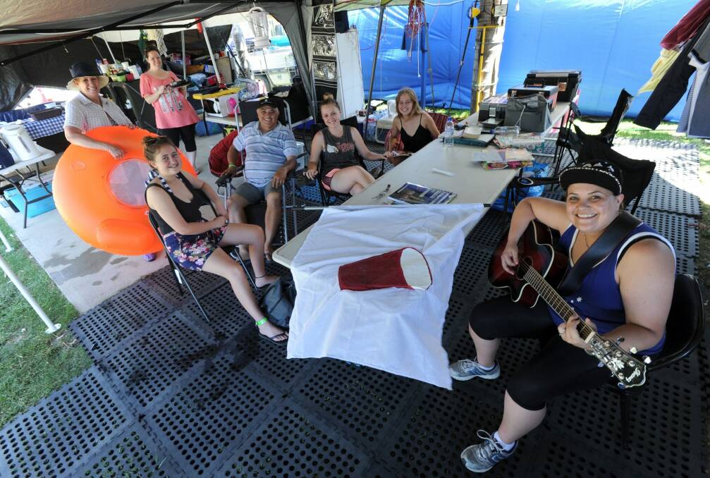 Family time: Sydneysider Colin Watego  inside his Nelligen set-up with (rear, from left) wife Noela Watego and Becci Flint, (front, from left) Alyssa Hope, Colin, Nicola Hope, Amy-Lee Hope and Renee Watego.  Photo: Graham Tidy