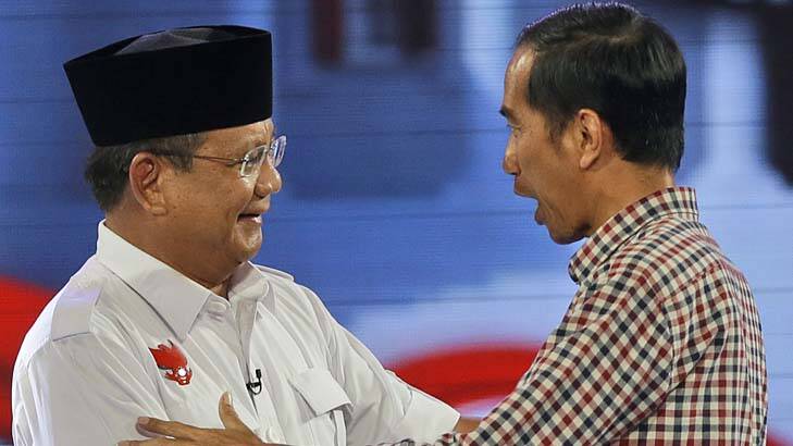 Indonesian election: Joko Widodo, right, shakes hands with his opponent Prabowo Subianto. Photo: AP