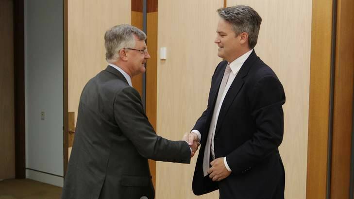 Dr Martin Parkinson, Treasury Secretary greets Senator Mathias Cormann ahead of the hearing into the mining tax in April. The two disagree about whether Treasury is independent from the Labor government. Photo: Alex Ellinghausen