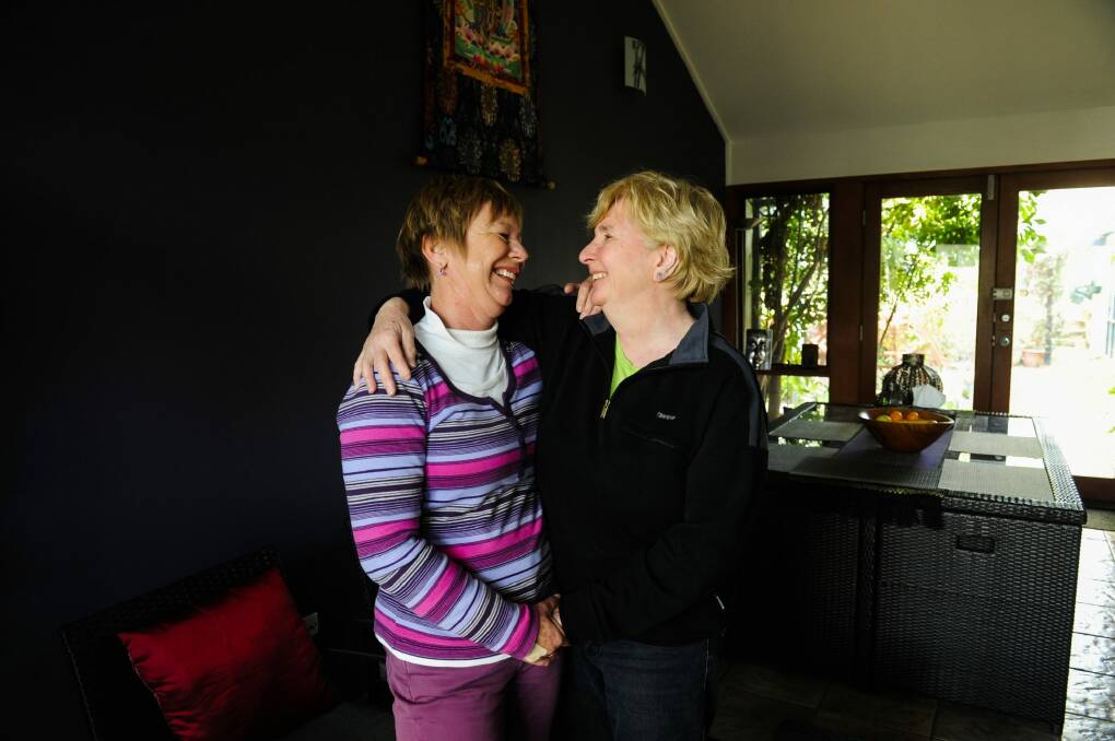 With federal parliament moving towards a possible vote on same-sex marriage, Hackett couple Veronica Wensing and Krishna Sadhana are excited but wary. Photo: Melissa Adams