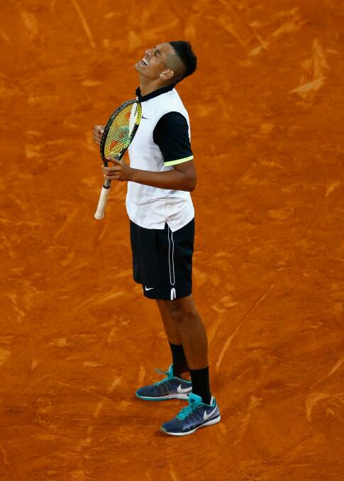 Nick Kyrgios celebrates defeating Roger Federer during day five of the Mutua Madrid Open. Photo: Getty Images