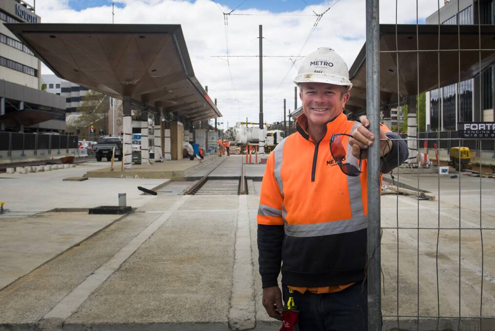 Light rail construction worker, Ross Gothard, at the close-to-complete station at Alinga Street. Photo: Elesa Kurtz