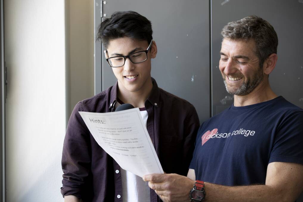 Jackson Houng auditioning to be the voice of Canberra's light rail with the help of teacher Lex Warfield. Photo: Sitthixay Ditthavong