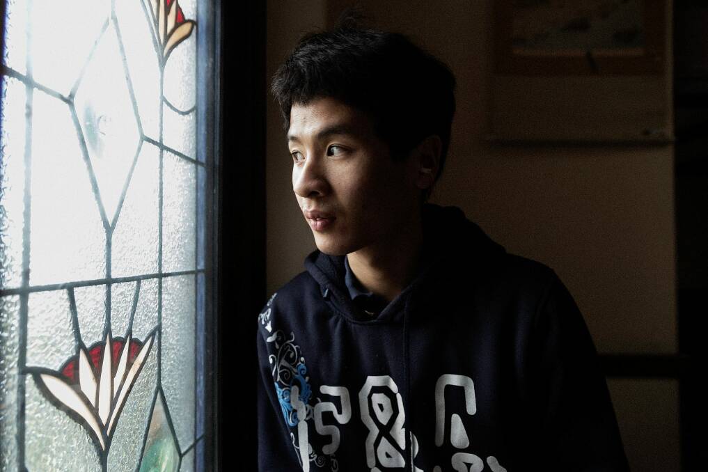 Tim Chan has severe autism and cannot speak or write. He uses an electronic voice-output device to communicate and write poetry.  Photo: Getty/Paul Jeffers