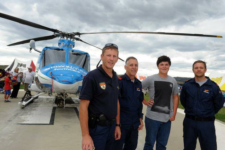 SouthCare flight paramedic Pat Cotter and aircrewmen Steve Aker and Brad Nagy meet one of the people they have recued, Ryan Decon at the SouthCare open day. Photo: Gary Schafer