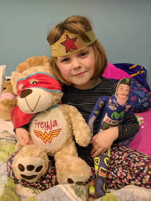 Canberra girl Freyja Christiansen in hospital in her Wonder Woman gear. Photo: supplied