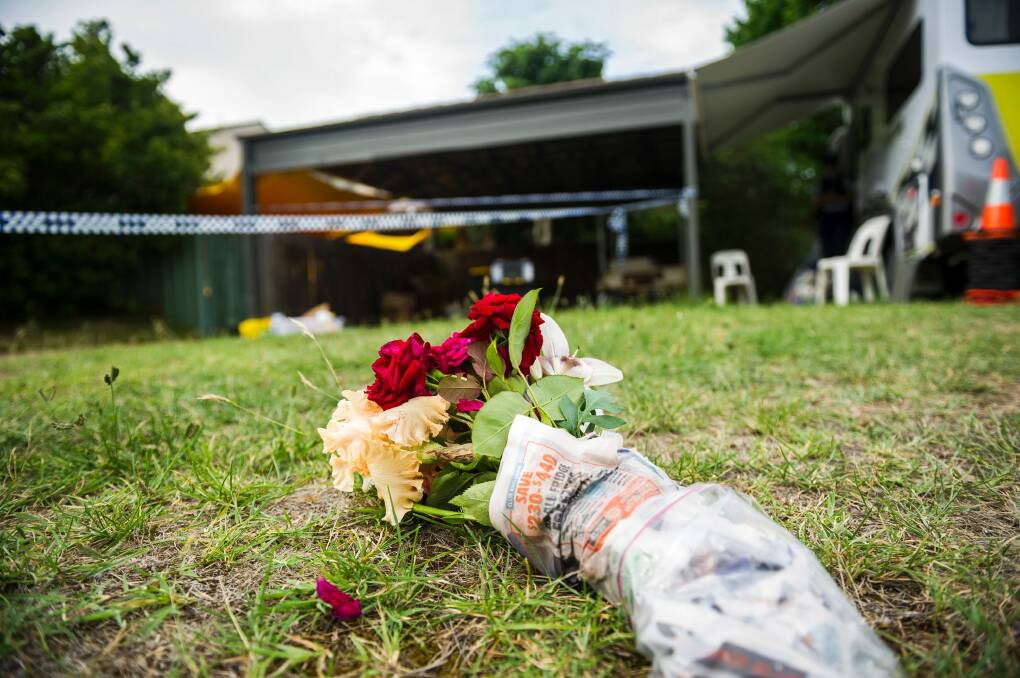 Flowers left outside the house on Monday afternoon. Photo: Dion Georgopoulos