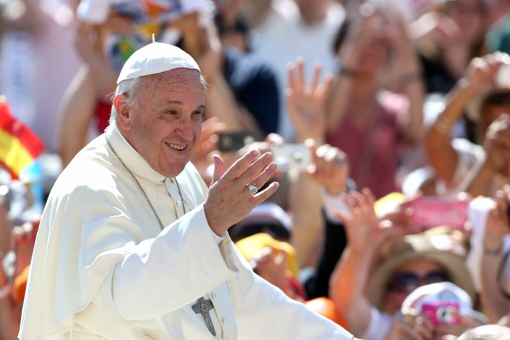 Pope Francis waves to the faithful in Vatican City earlier this month. Photo: Getty Images