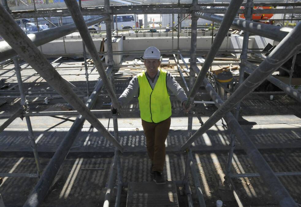 Pool developer Phil King inspects the construction of Calwell’s Kingswim aquatic facility. Photo: Emma Kelly