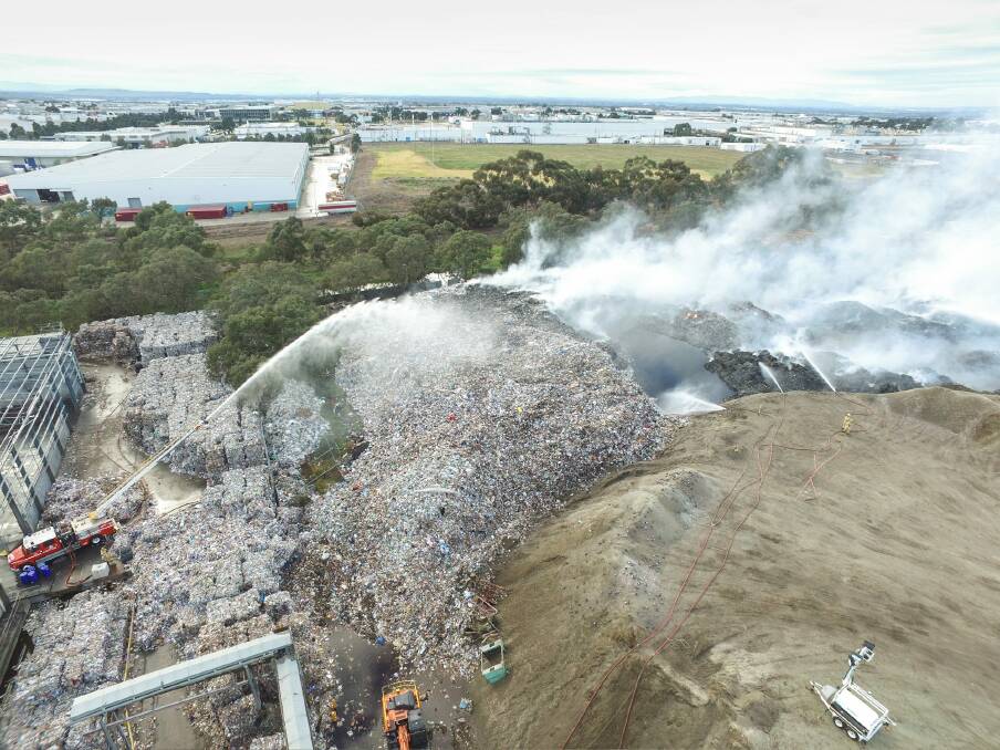 The July 2017 fire at the SKM's plant in Coolaroo, where tonnes of recycling had been stockpiled.  Photo: MFB