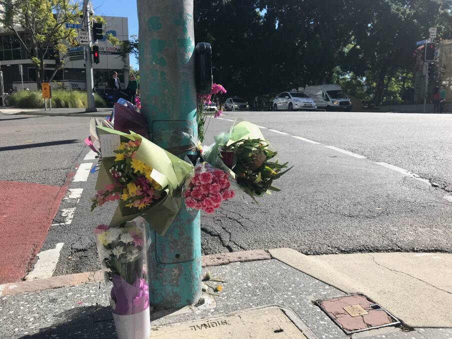 Flowers were laid at the Ann Street intersection where a woman was killed last month. Photo: Fairfax Media/Amy Mitchell-Whittington