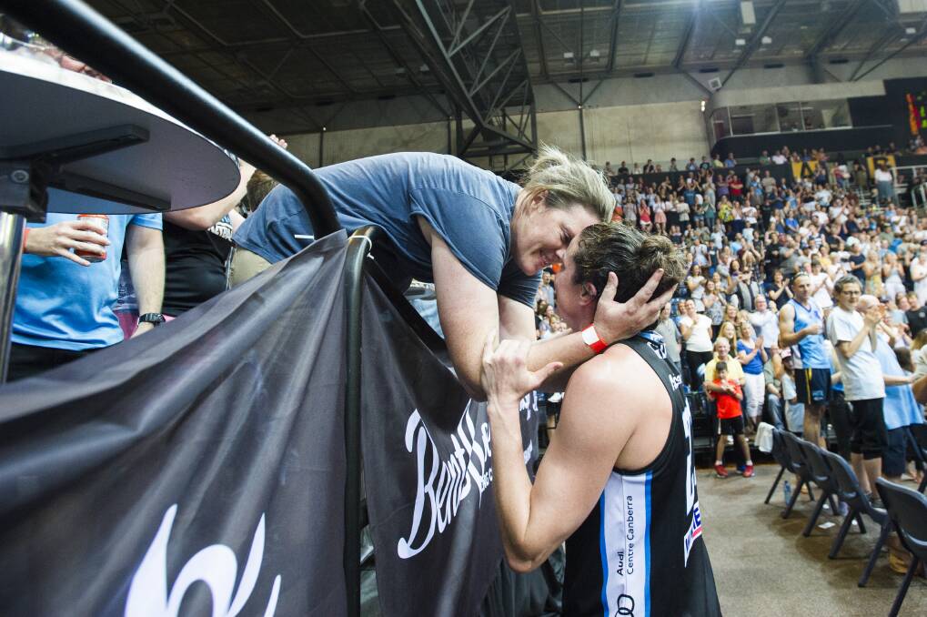 Kelsey Griffin kisses her wife Erin after winning the grand final. Photo: Dion Georgopoulos