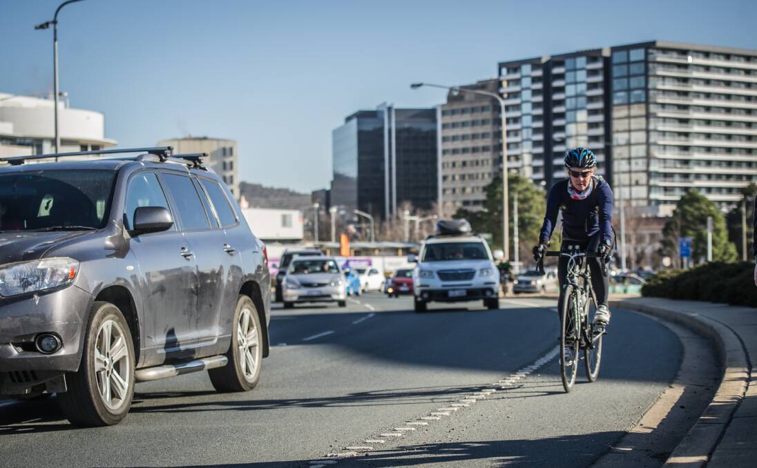 Rules requiring motorists to stay one metre clear of cyclists when overtaking them in speed zones of 60km/h or less will be made permanent. Photo: Karleen Minney