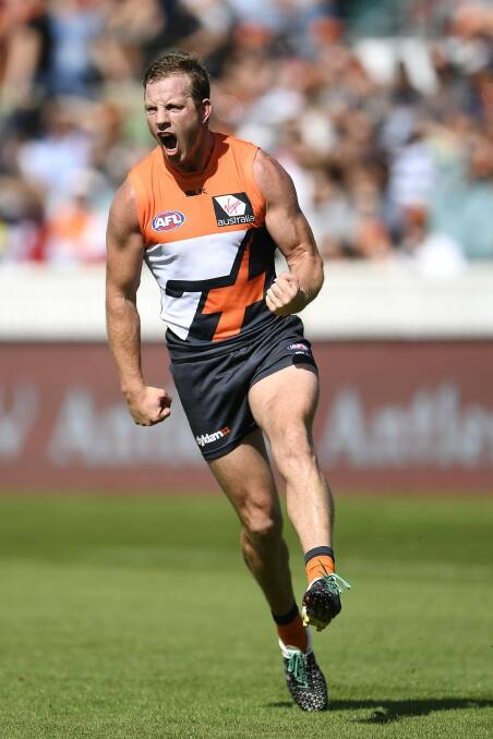 Steve Johnson of the Giants celebrates kicking a goal during the round two AFL match between the Greater Western Sydney Giants and the Geelong Cats at Manuka Oval on Sunday. Photo: Brett Hemmings/AFL Media