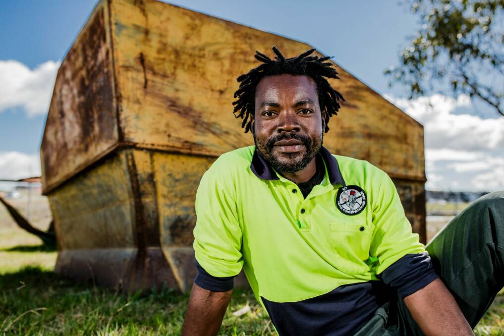 ACT Parks and Conservation's Service seasonal firefighter Rocky Simachila is using his skills learned in Africa to protect the Canberra community. Photo: Jamila Toderas