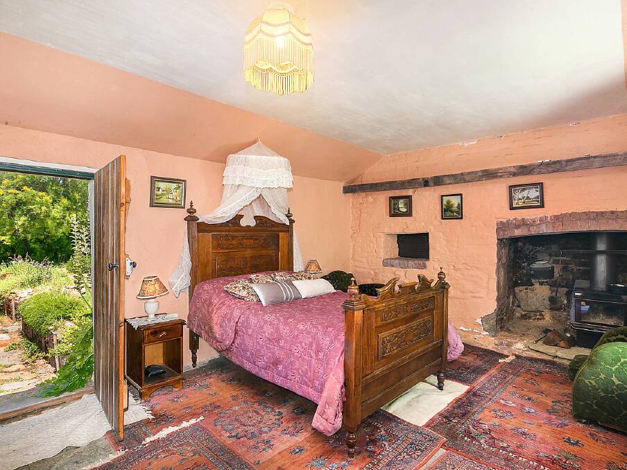 How many houses can boast a guest bedroom with an old bread oven as a bedside table? Photo: Dave Moore