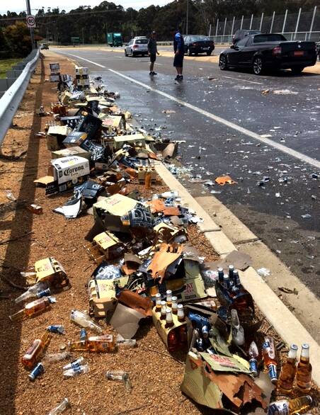 D'oh! Beer meant for a wedding spilled over Cotter Road on Friday. Photo: Supplied