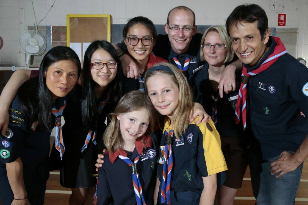 ACT Scouts from different language groups, rear from left, Chinese Phoenix Scout Group leader Joanne Guth, venturer Sunny Xu, rover Jessica Ying with Les Explorateurs cub scout leader Philippe Moncuquet, assistant cub scout leader Sarah Moncuquet, Pioneros Scout Group cub scout leader Carlos Torres, front from left, Les Explorateurs joey Marion Moncuquet and cub Coline Moncuquet.  Photo: Jeffrey Chan