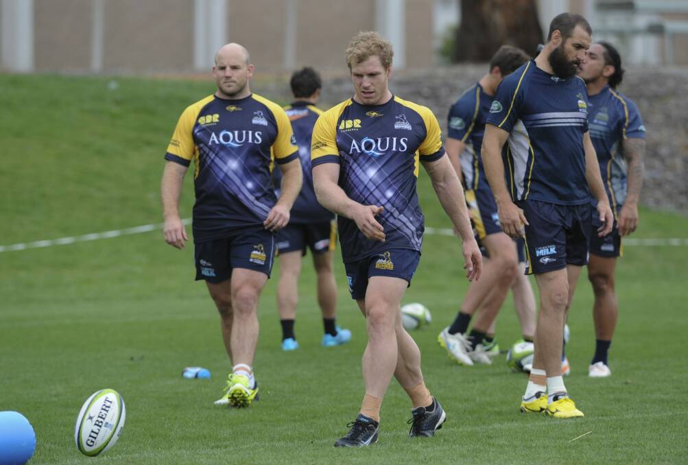 Brumbies captain Stephen Moore, David Pocock and Scott Fardy are back at training after an eventful off-season. Photo: Graham Tidy