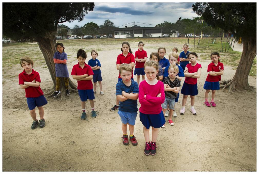 Footscray Primary School students on the oval where asbestos has been found.
 Photo: Simon O'Dwyer