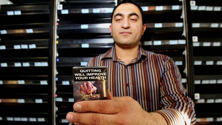 IGA Xpress Canberra City owner Abdul Osman says cigarettes in plain packaging and cigarette units are a nightmare. Photo: Melissa Adams