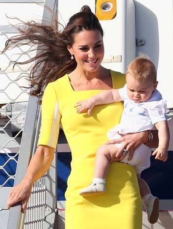 A bright yellow ensemble: The Duchess disembarks the plane with Prince George. Photo: Getty Images