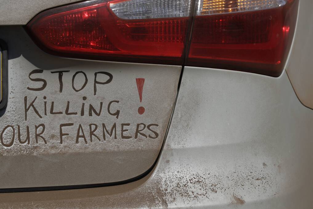 A bumper sign during a blockade of the freeway between Johannesburg and Vereeniging, in Midvaal, South Africa, last year in protest against the murder of farmers. Photo: AP