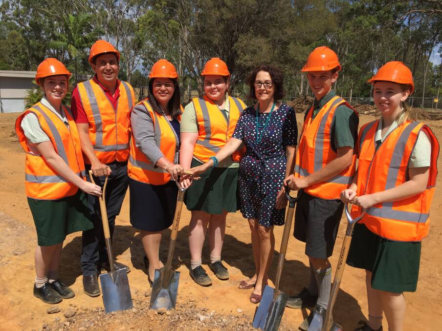 Queensland Education Minister Grace Grace with Capalaba MP Don Brown, Alexandra Hills State High School Principal Gail Armstrong and students turn the first sod at the site of the school's new automation and robotics centre. Photo: Supplied
