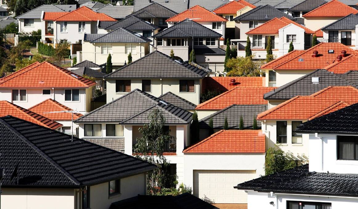 House values were lower in five of the eight capital cities last month. Photo: Louie Douvis