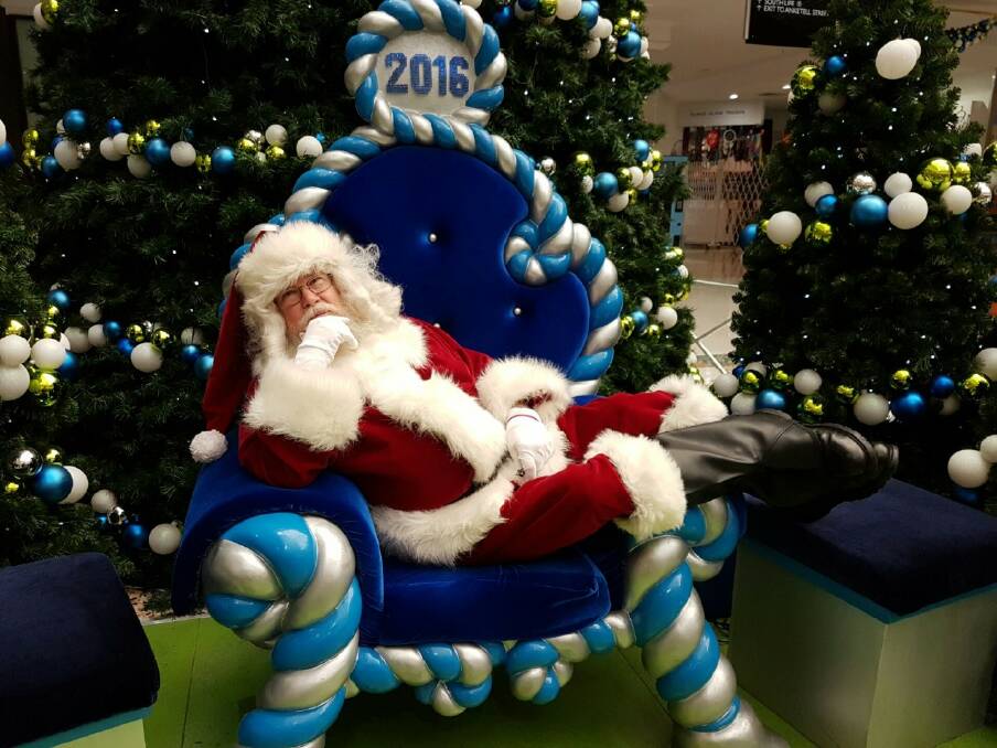 Canberra Santa Claus Tony Moore having a little rest in his lunchbreak at South.Point shopping centre. Photo: Supplied