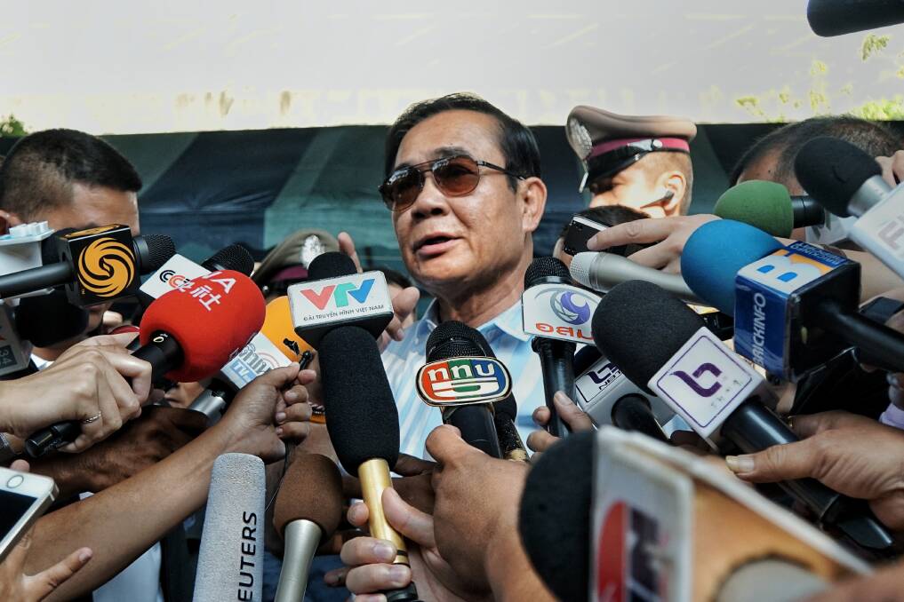 Thailand's PM Prayut Chan-o-cha addresses the waiting media after casting his vote on Sunday.  Photo: Amilia Rosa