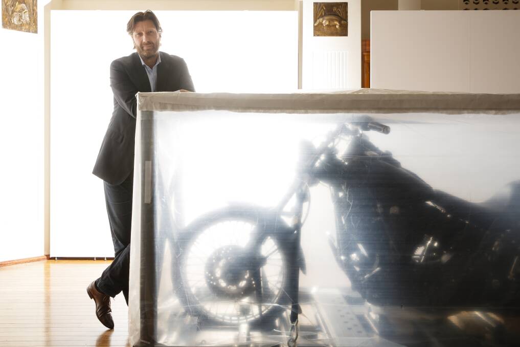 Under wraps: National Film and Sound Archive CEO Jan Müller with Heath Ledger's Harley- Davidson.  Photo: Sitthixay Ditthavong