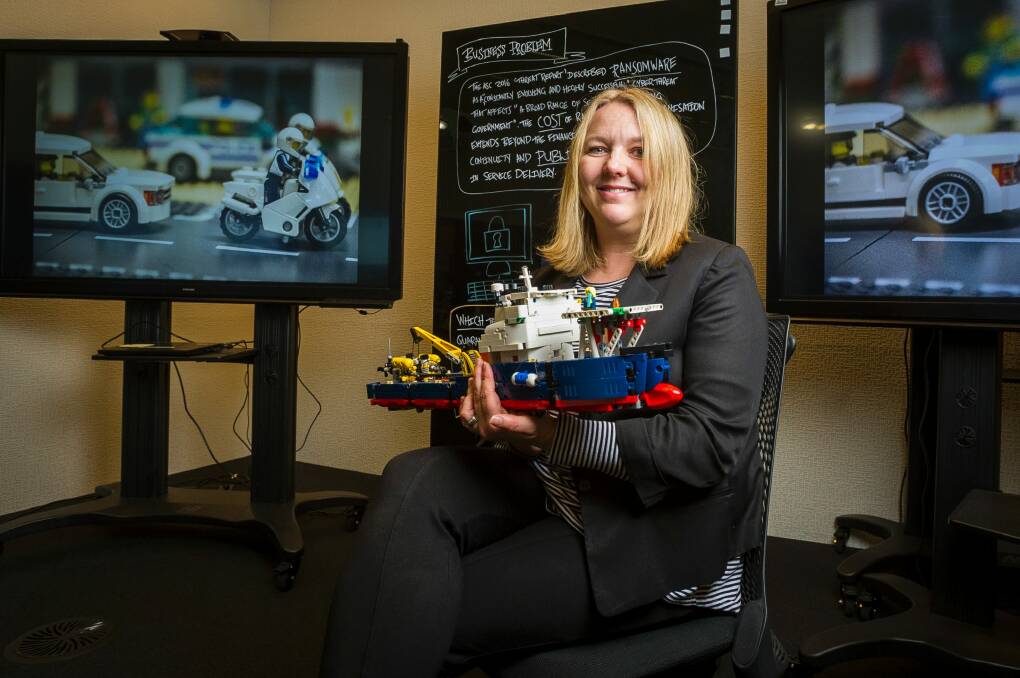 National manager of cyber security at DHS Narelle Devine with a Lego model to be used in cyber war games this year. Photo: Dion Georgopoulos
