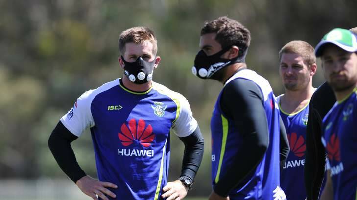 PEAK FITNESS: Raiders players, including Josh McCrone, at left, try out the elevation training masks on Tuesday which are designed to increase breathing capacity. Photo: Melissa Adams