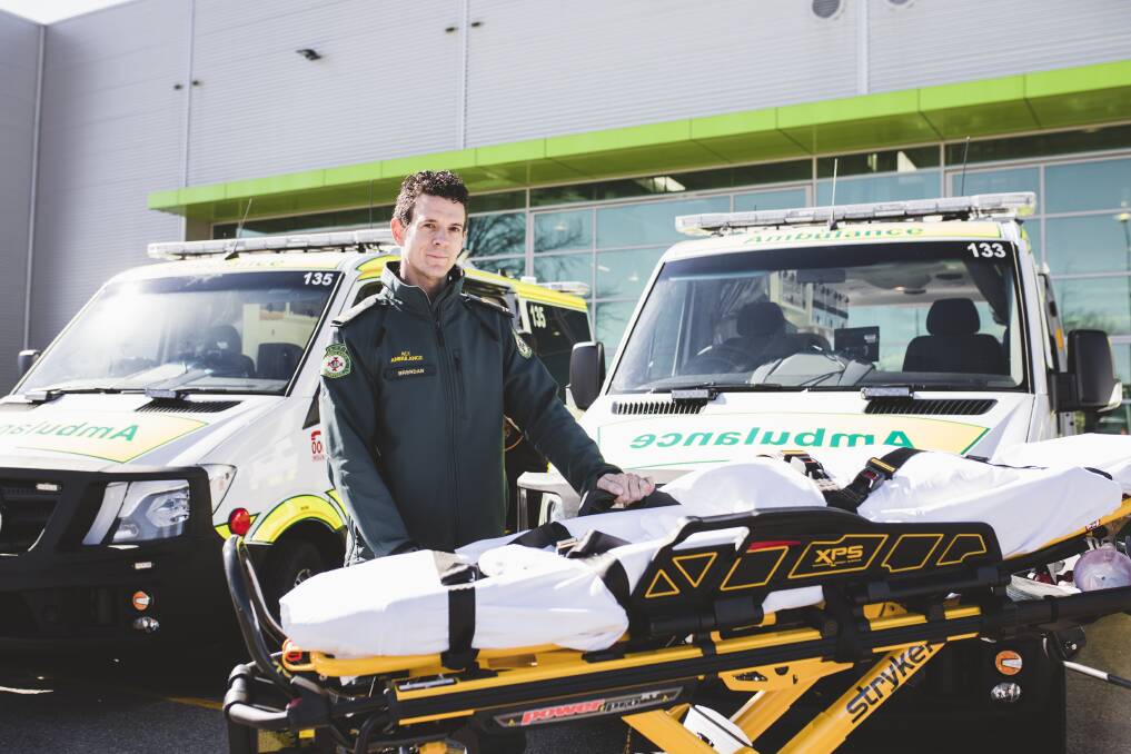 Intensive care paramedic Brendan Kelly with a new electric stretcher. Photo: Jamila Toderas