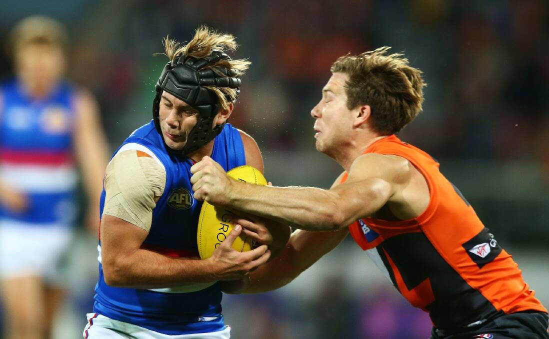 Toby Greene is in trouble for this contact with Bulldog Caleb Daniel. Photo: Getty Images