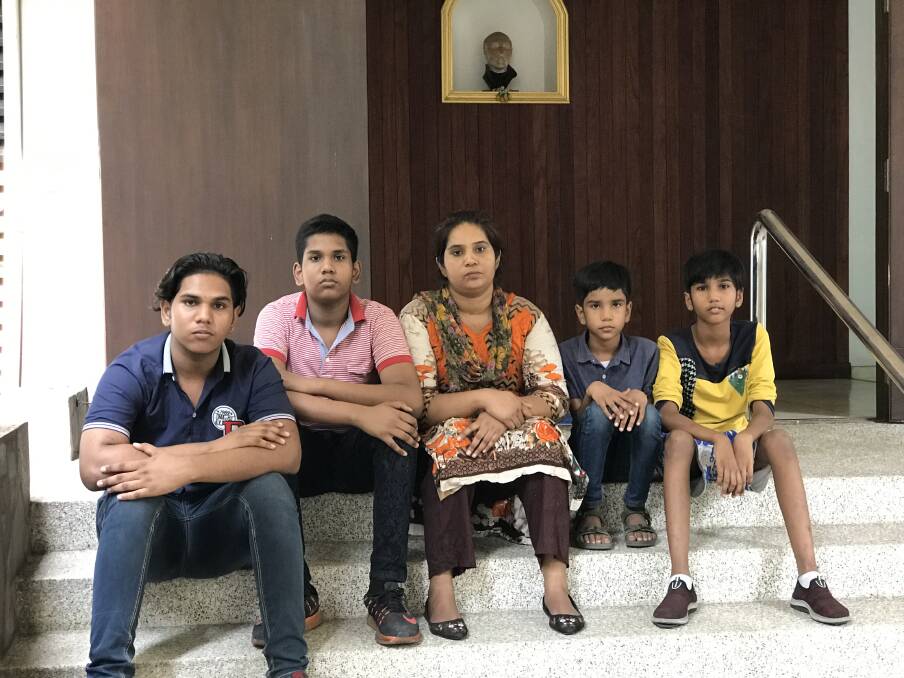 Pakistani Christian refugee Soniazahid Younis with her four sons, Shahzaib, 16, Shahwaiz, 14, Sharaiz, 10 and Zohaib, 8, at Xavier Hall in Bangkok. The family fled persecution in Pakistan and live in a legal limbo.  Photo: James Massola