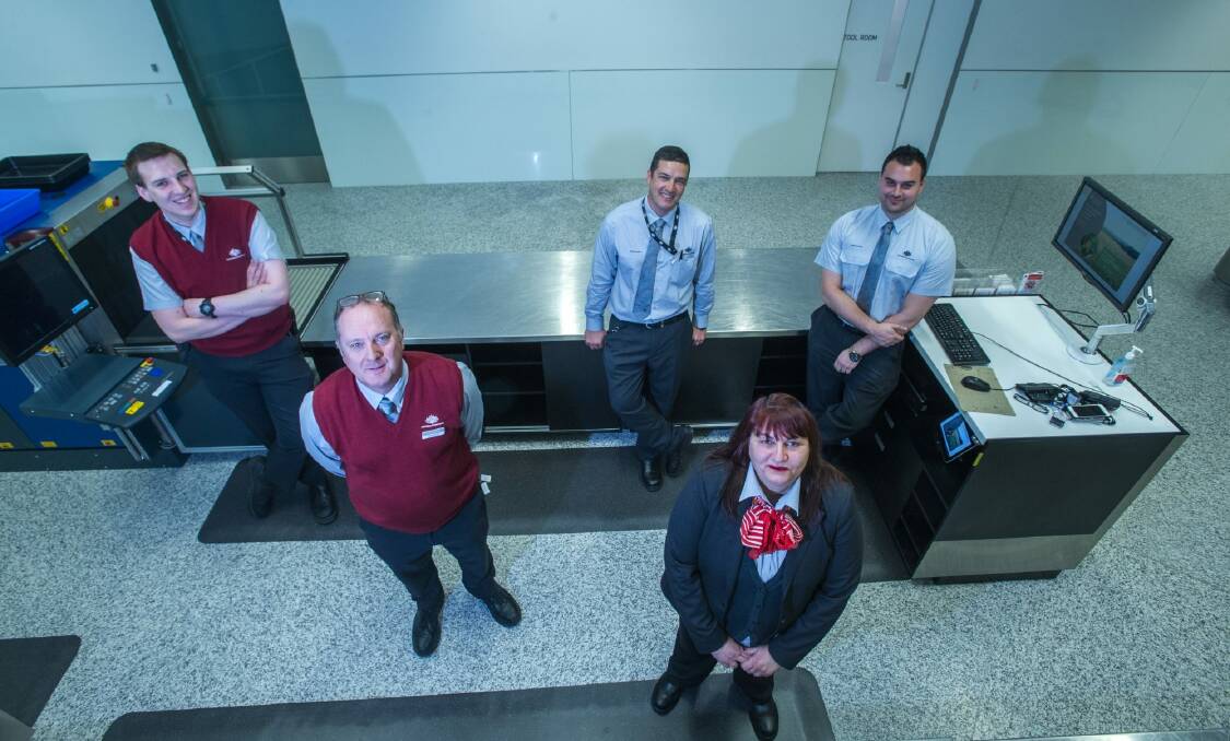 The team behind the scenes at the biosecurity unit at Canberra Airport. Biosecurity officers (from left) Casey, Peter, Osorio, Cristina and Chris.  Photo: karleen minney