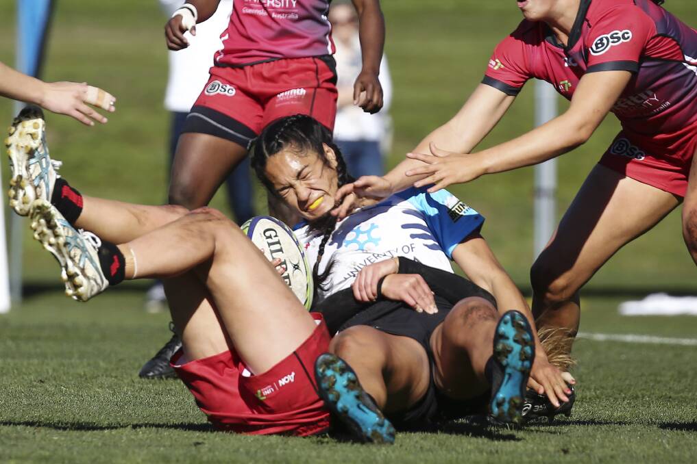 Crunched: The University of Canberra sevens side struggled on the Gold Coast. Photo: Rugby Australia