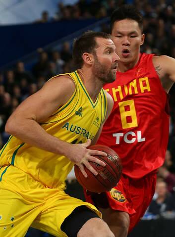Anthony Petrie of the Boomers drives to the basket against Zhu Fangyu of China on Friday night. Photo: Getty Images